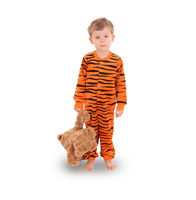 Little boy in pyjamas with a teddy bear