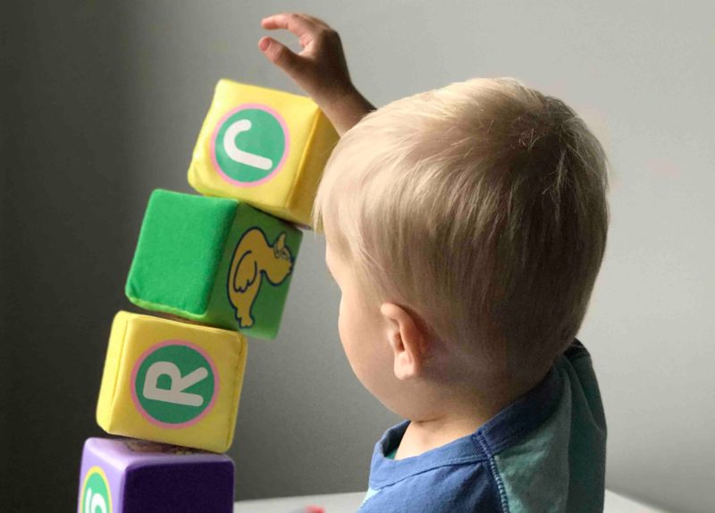 Child stacking blocks