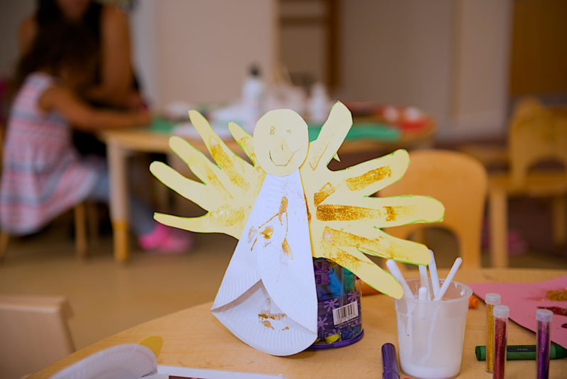 Christmas crafts: a paper angel covered in gold glitter