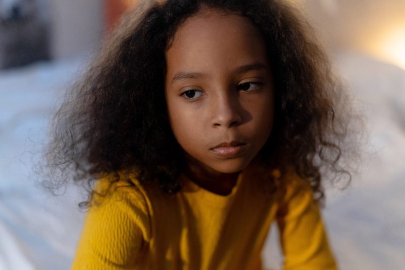 Partner coercive control - child looking serious
