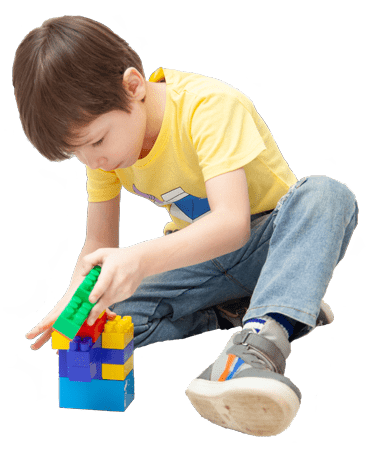 Boy playing with colourful blocks