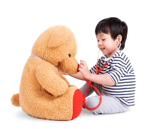 Toddler holding stethoscope to teddy