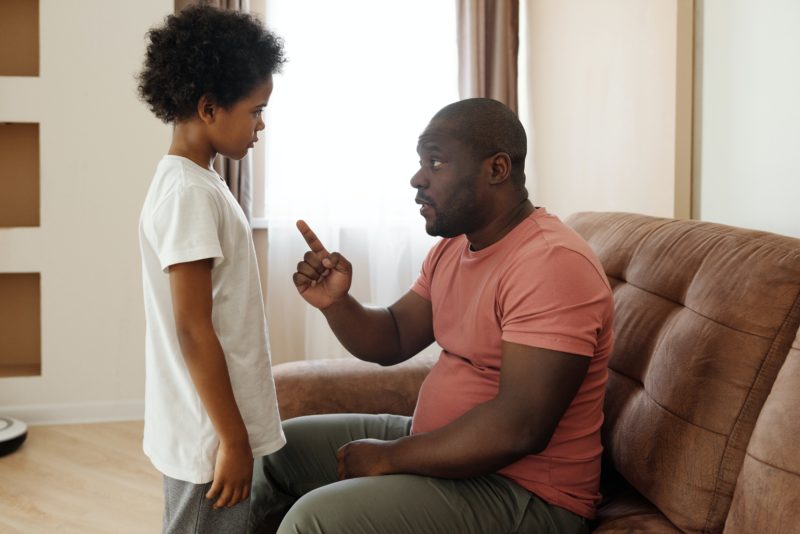 Smacking - Parent disciplining boy with words
